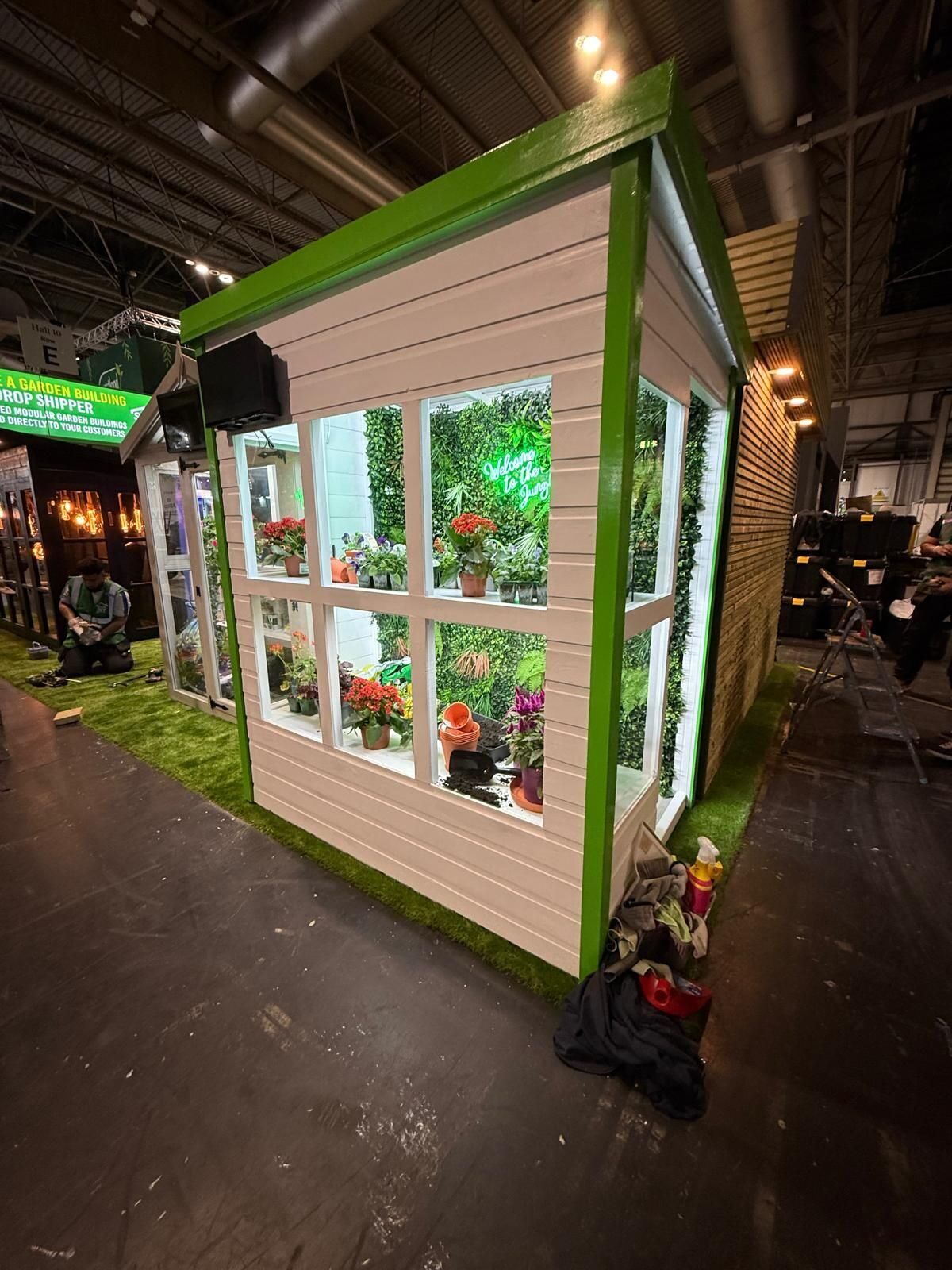 Total Sheds Potting Shed at Glee Garden Show, NEC Birmingham — rear corner view with plants